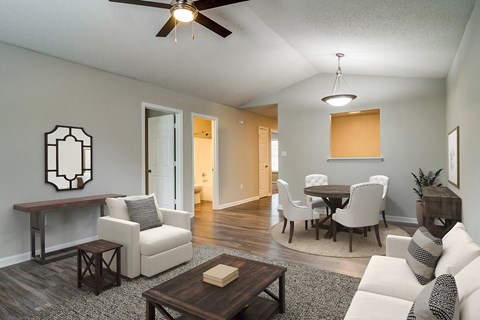 an open living room and dining room with a table and chairs